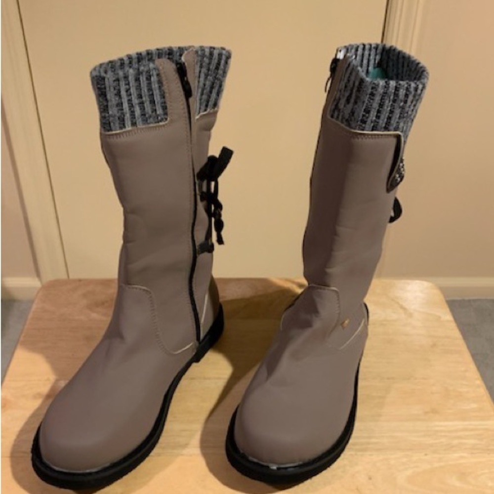 Faux leather lined, weatherproof,  zip up boots. Women’s Size 10 NWOT